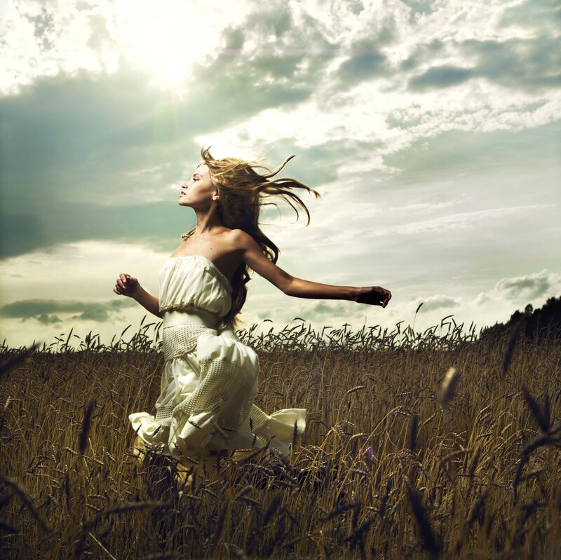 Woman Running in Field — White, Dramatic