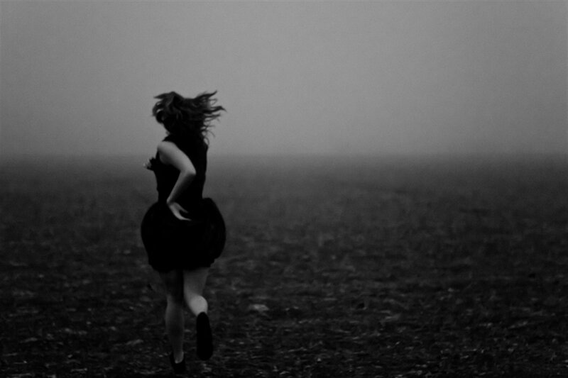 Woman Running in Fog