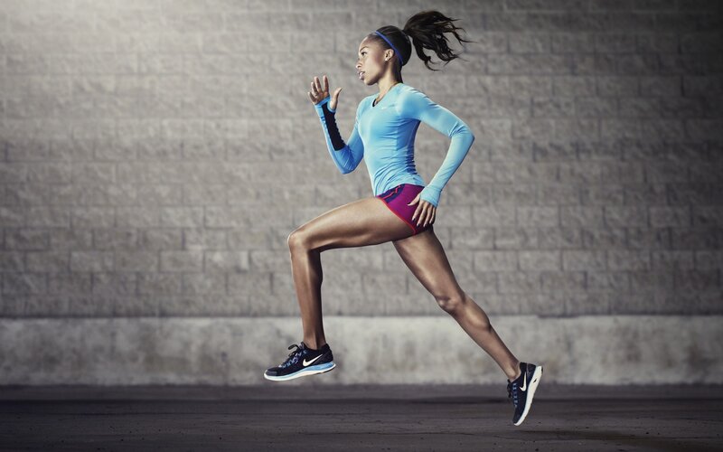 Woman Running in Motion — Blue