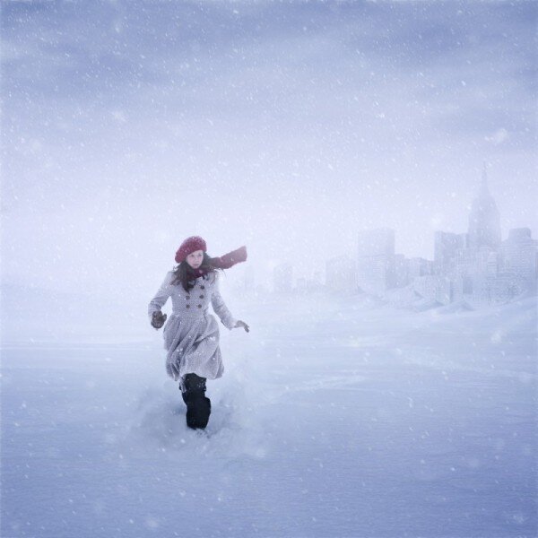 Woman running in snowstorm
