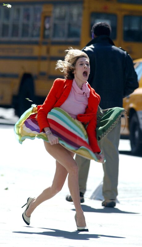 Woman running in windy conditions