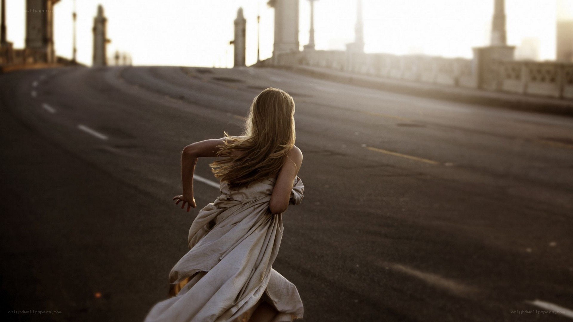woman running on a bridge