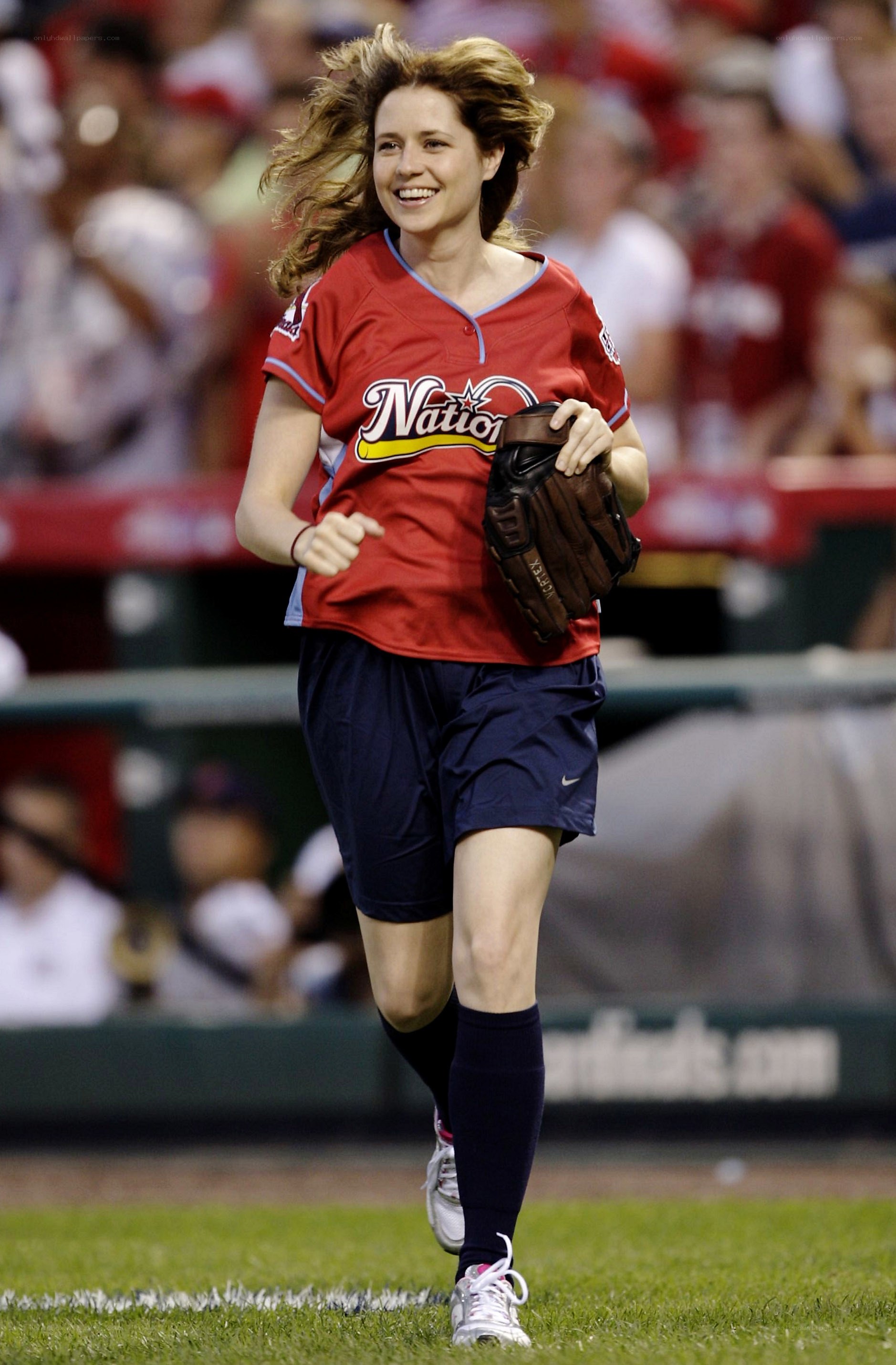 woman running on baseball field