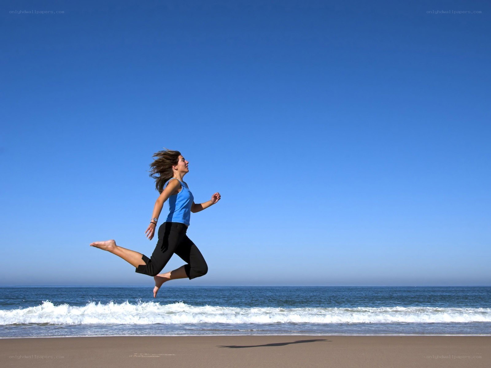 Woman running on beach