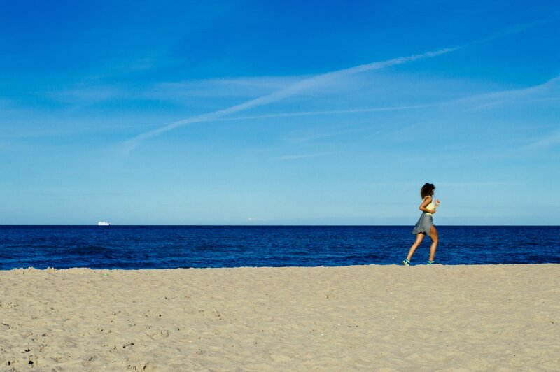 Woman Running on Beach — Blue, Serene, Afternoon, Photograph, Ocean