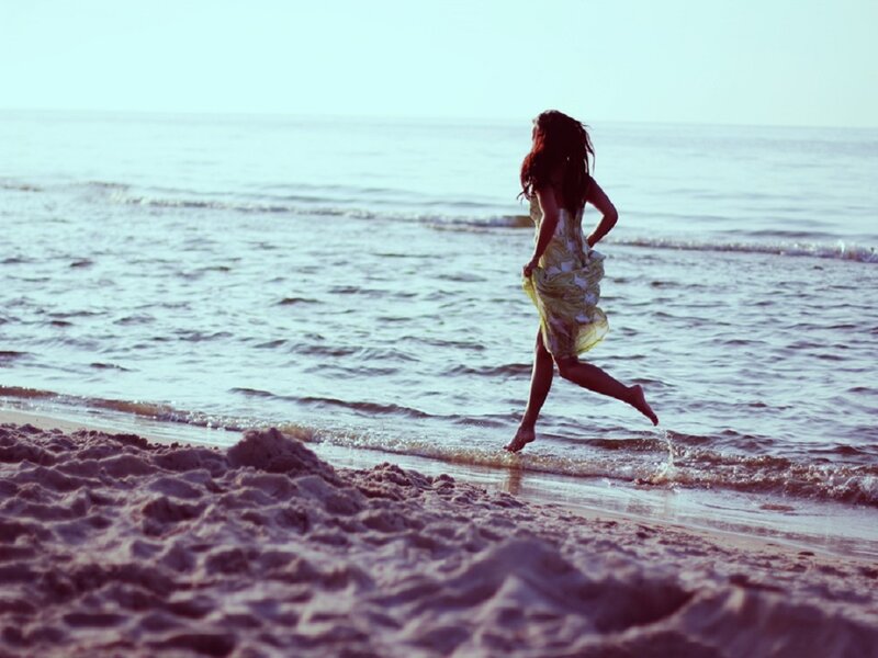 Woman Running on Beach — Blue, Serene, Afternoon, Photograph