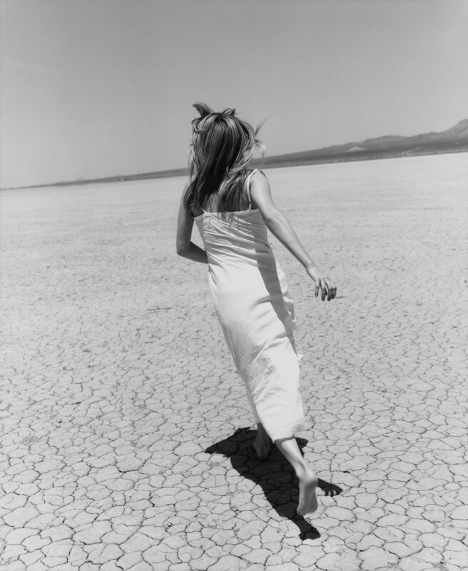 woman running on cracked earth