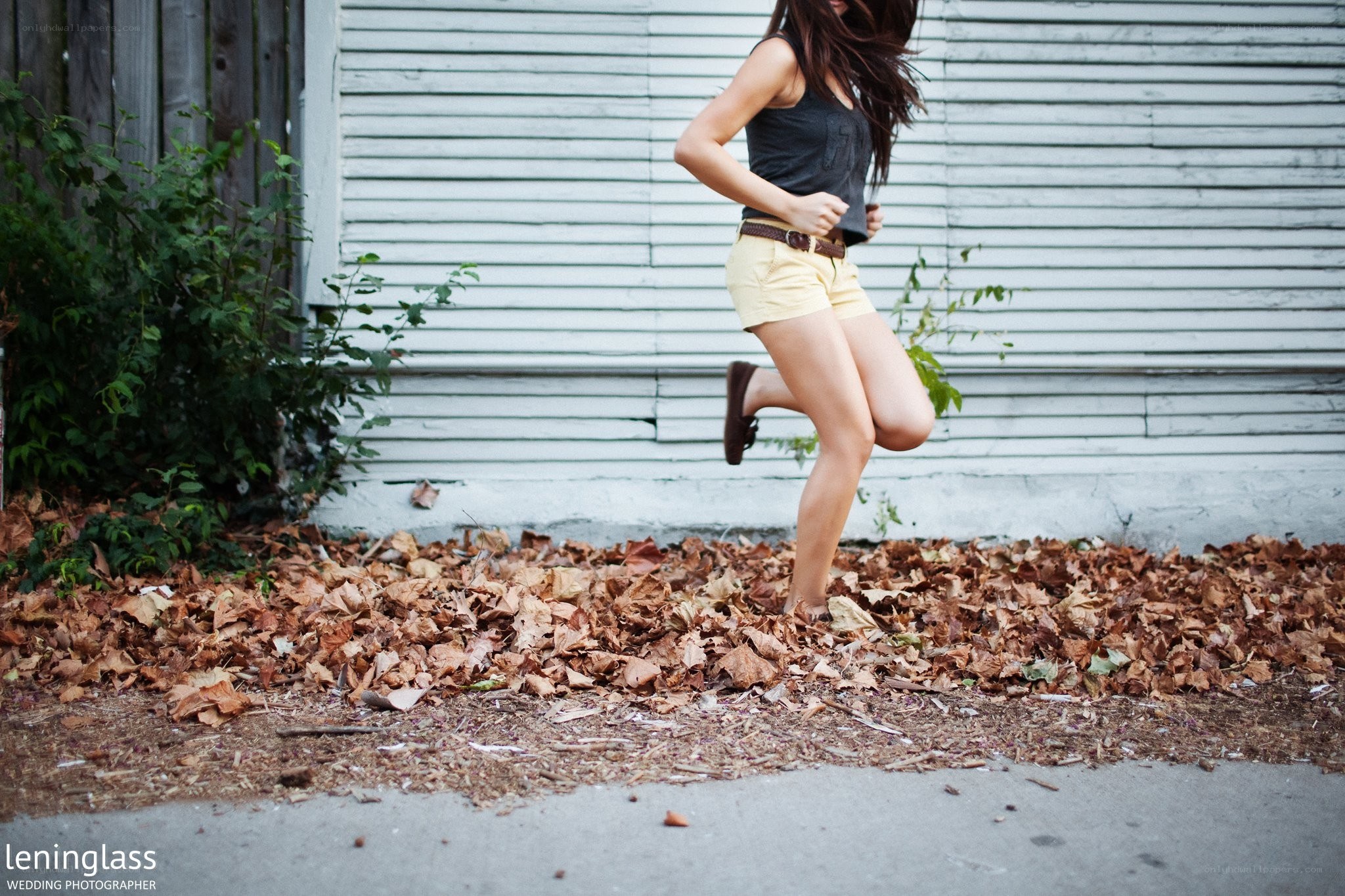 Woman running on leaves
