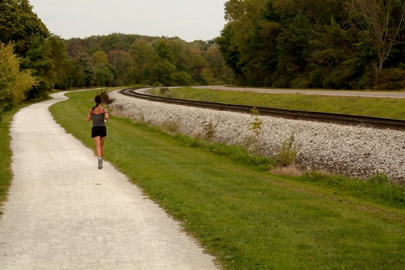 Woman Running on Path — Green