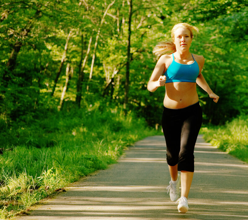 Woman Running on Path