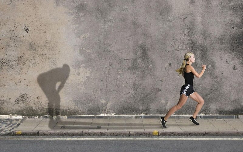 Woman Running on Sidewalk — Gray, Determined
