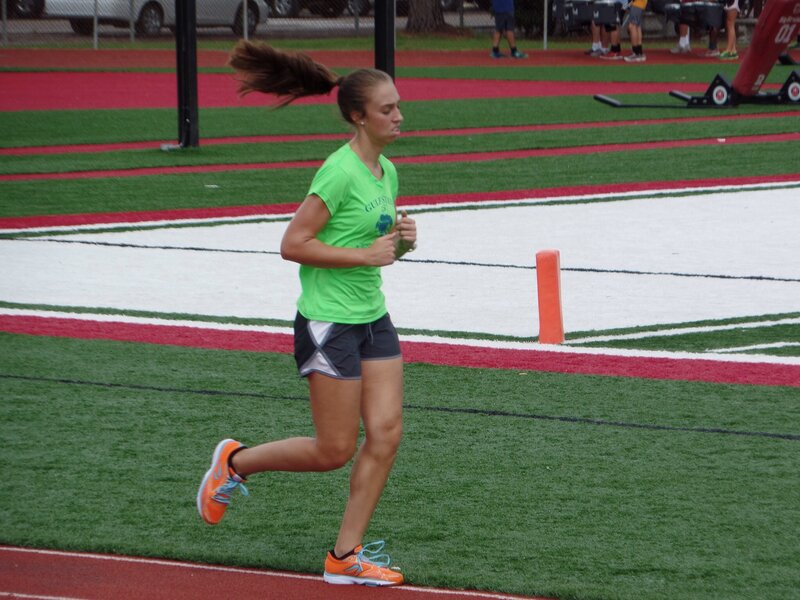 Woman Running on Track — Green