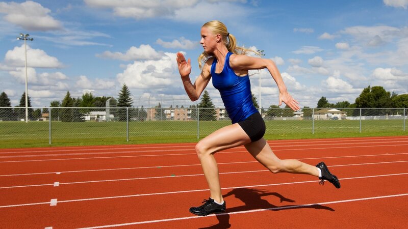 Woman Running on Track — Red