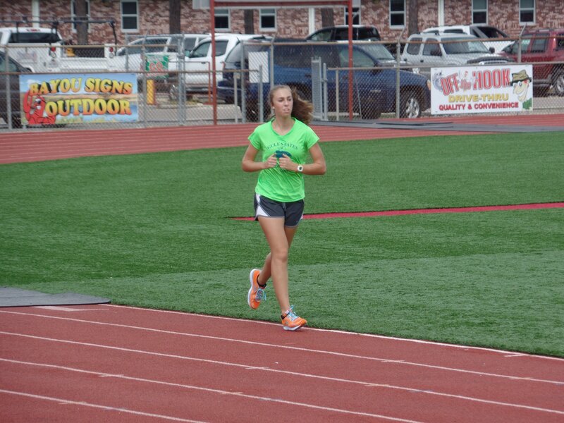 Woman Running on Track