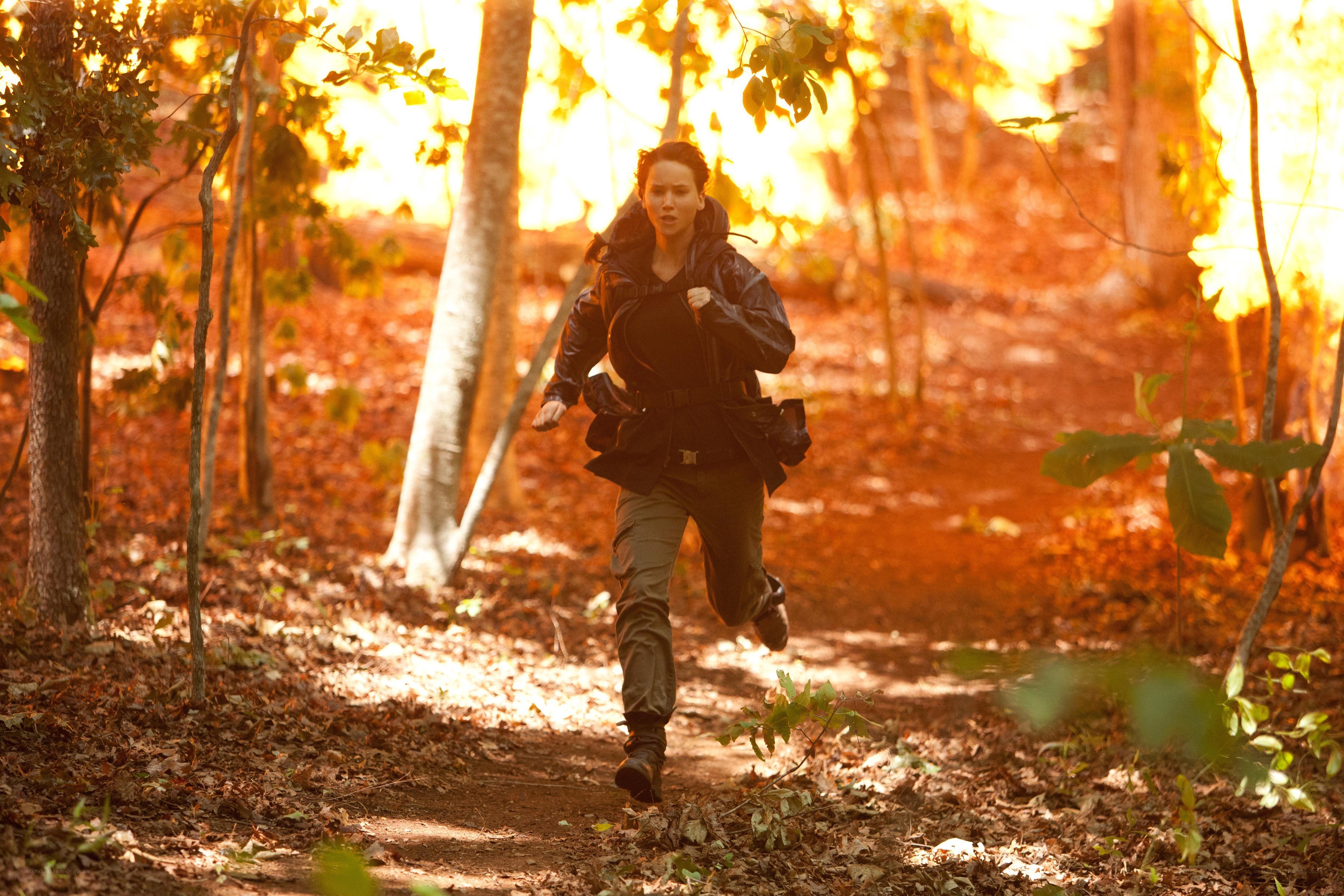 woman running through forest