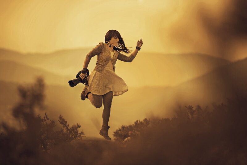 Woman Running with Camera
