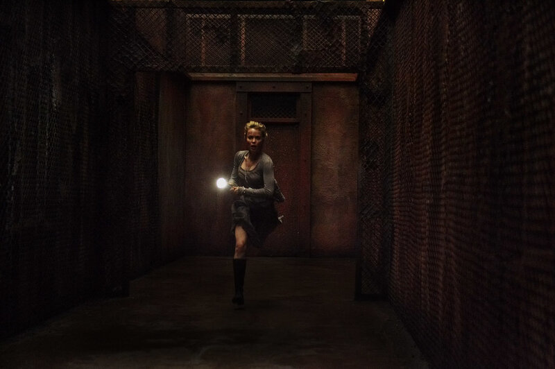 woman running with flashlight