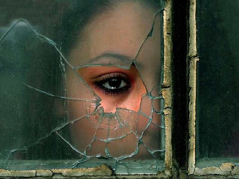 Woman's Eye Through Broken Glass — Green, Dramatic