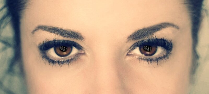 woman's eyes with text reflection