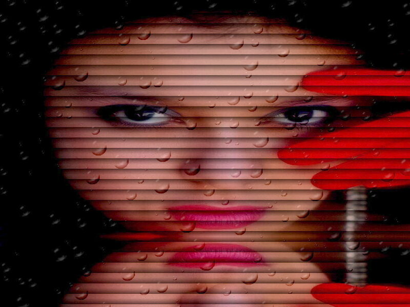 woman's face behind raindrops