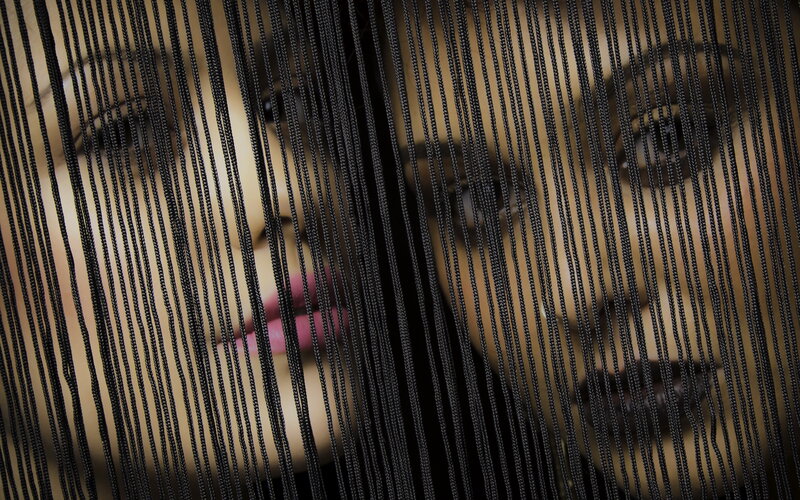 Woman's Face Behind Strings