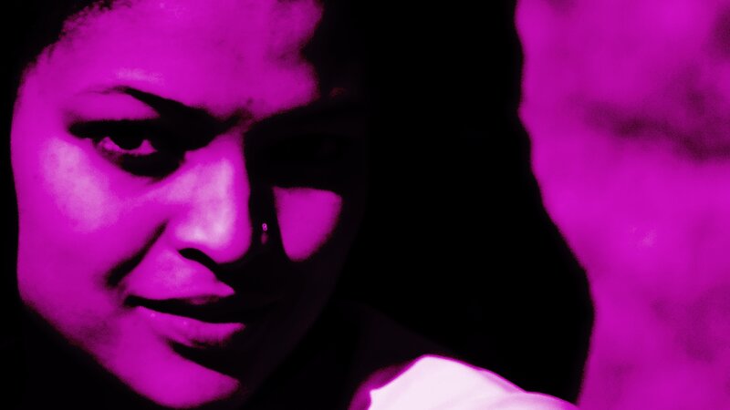 Woman's Face in Purple Light
