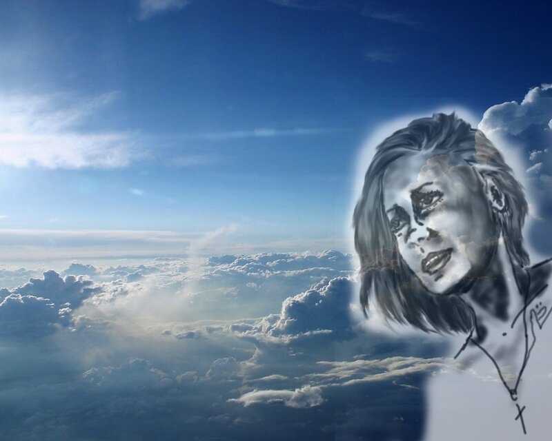 woman's face in the clouds