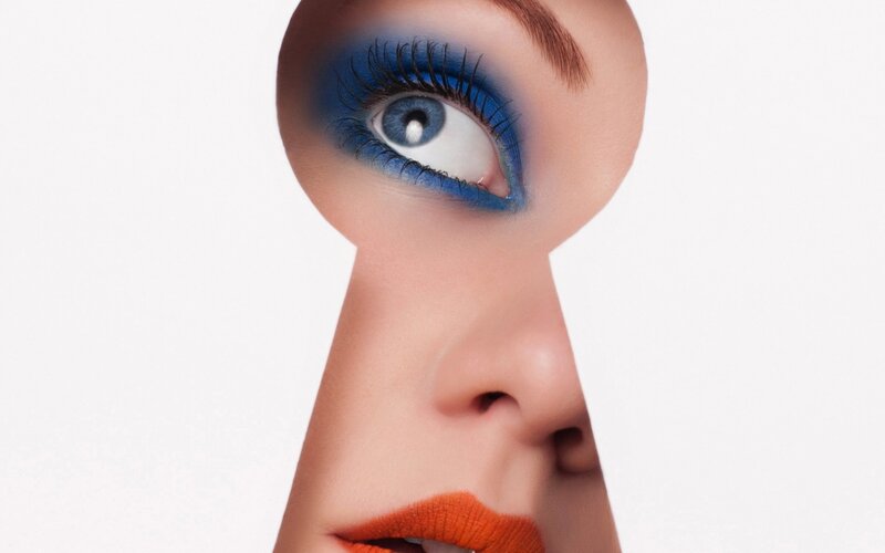 Woman's Face Through Keyhole
