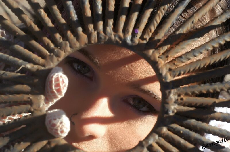 Woman's Face Through Metal