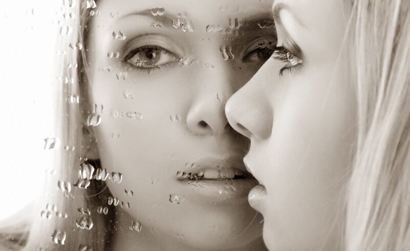 woman's face with raindrops