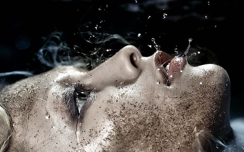 woman's face with water splashing