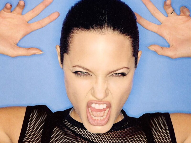 woman screaming on blue background