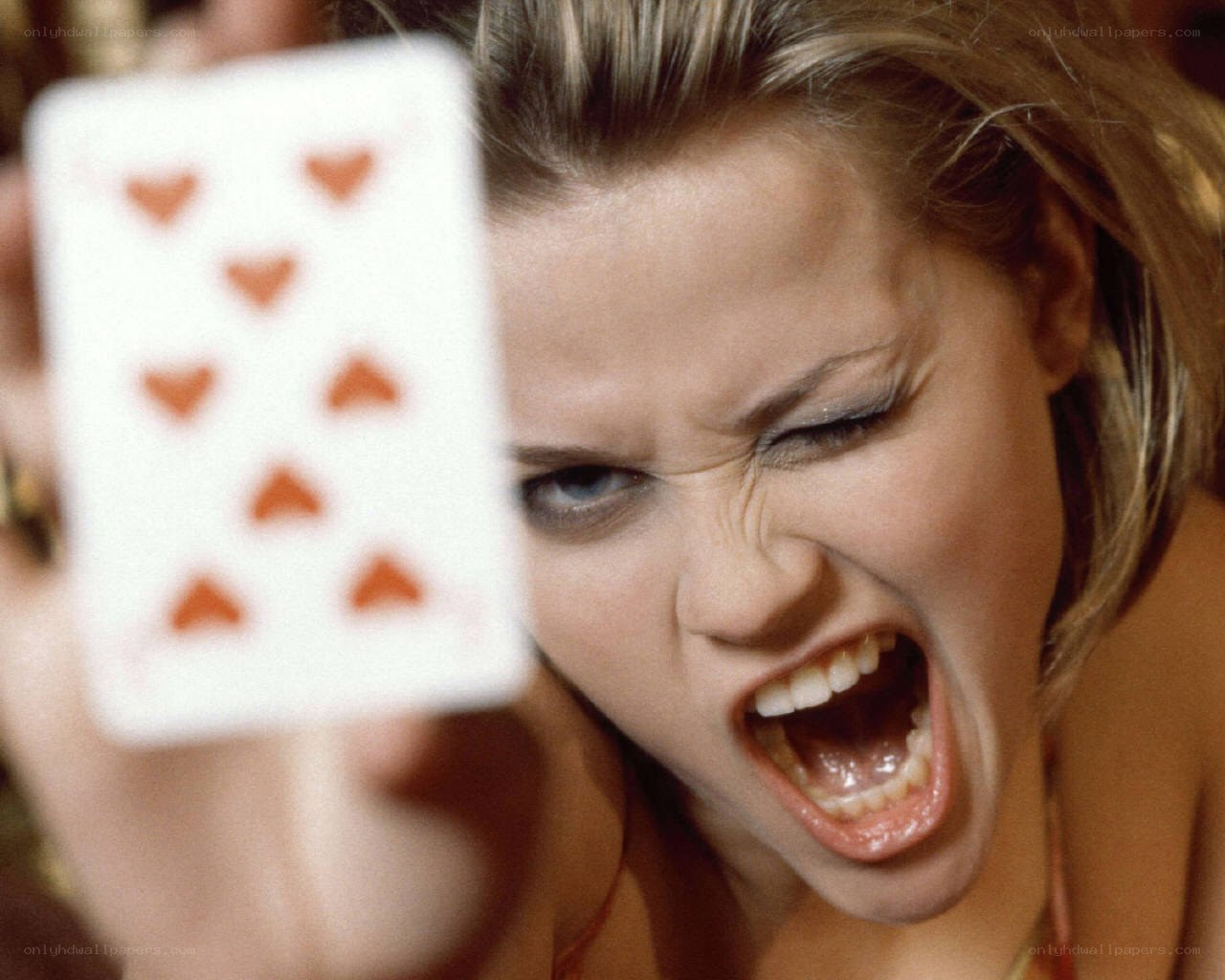 woman screaming with card