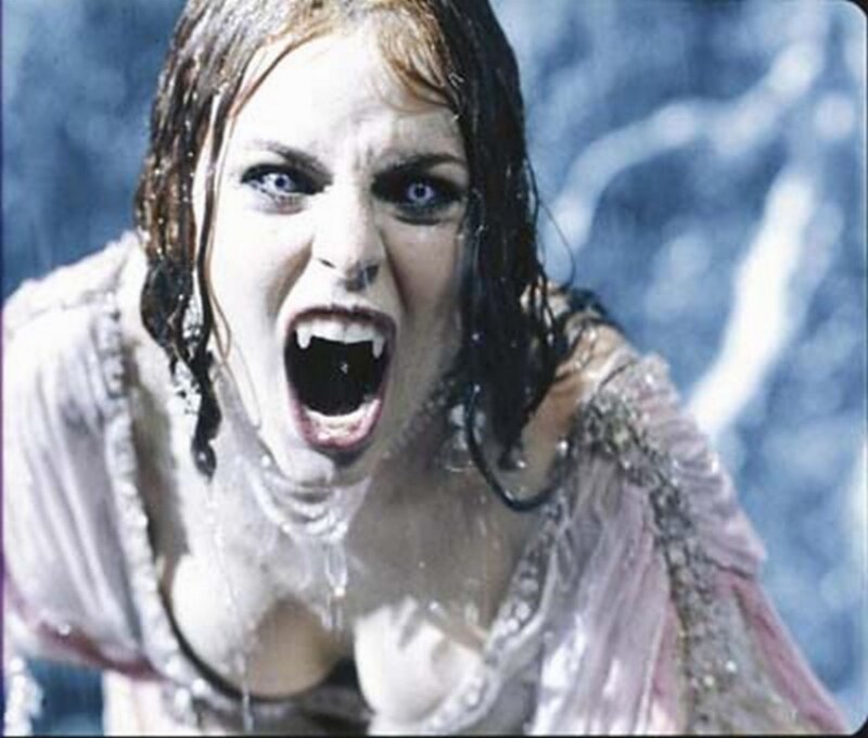 woman screaming with vampire fangs
