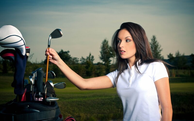 Woman Selecting Golf Club — White