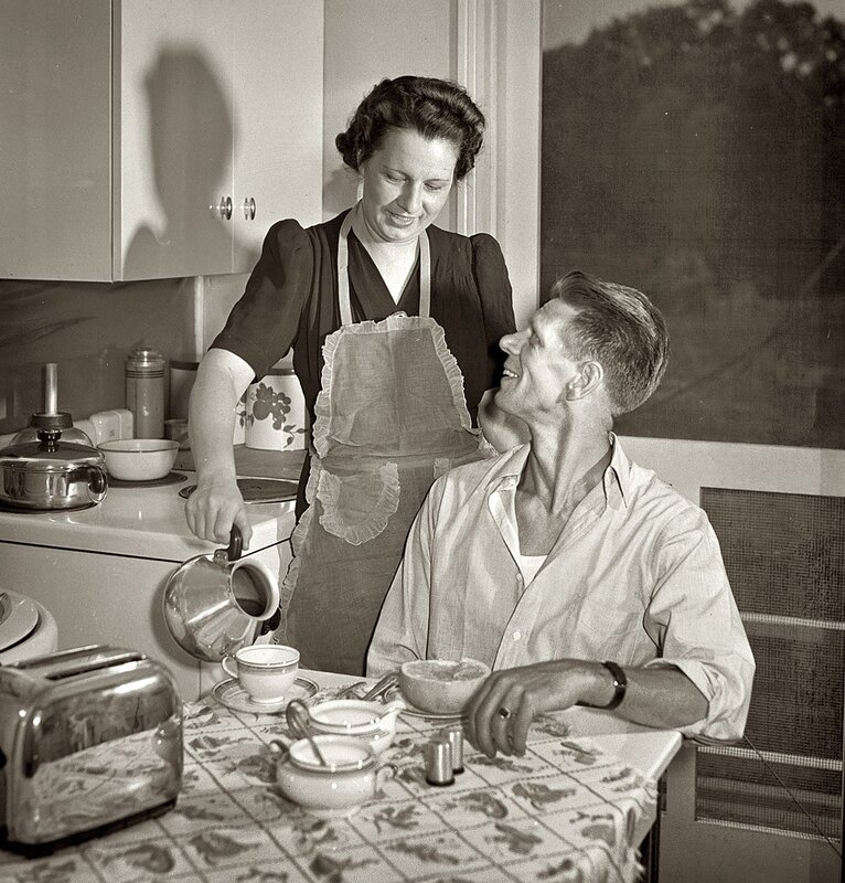Woman serving breakfast to man