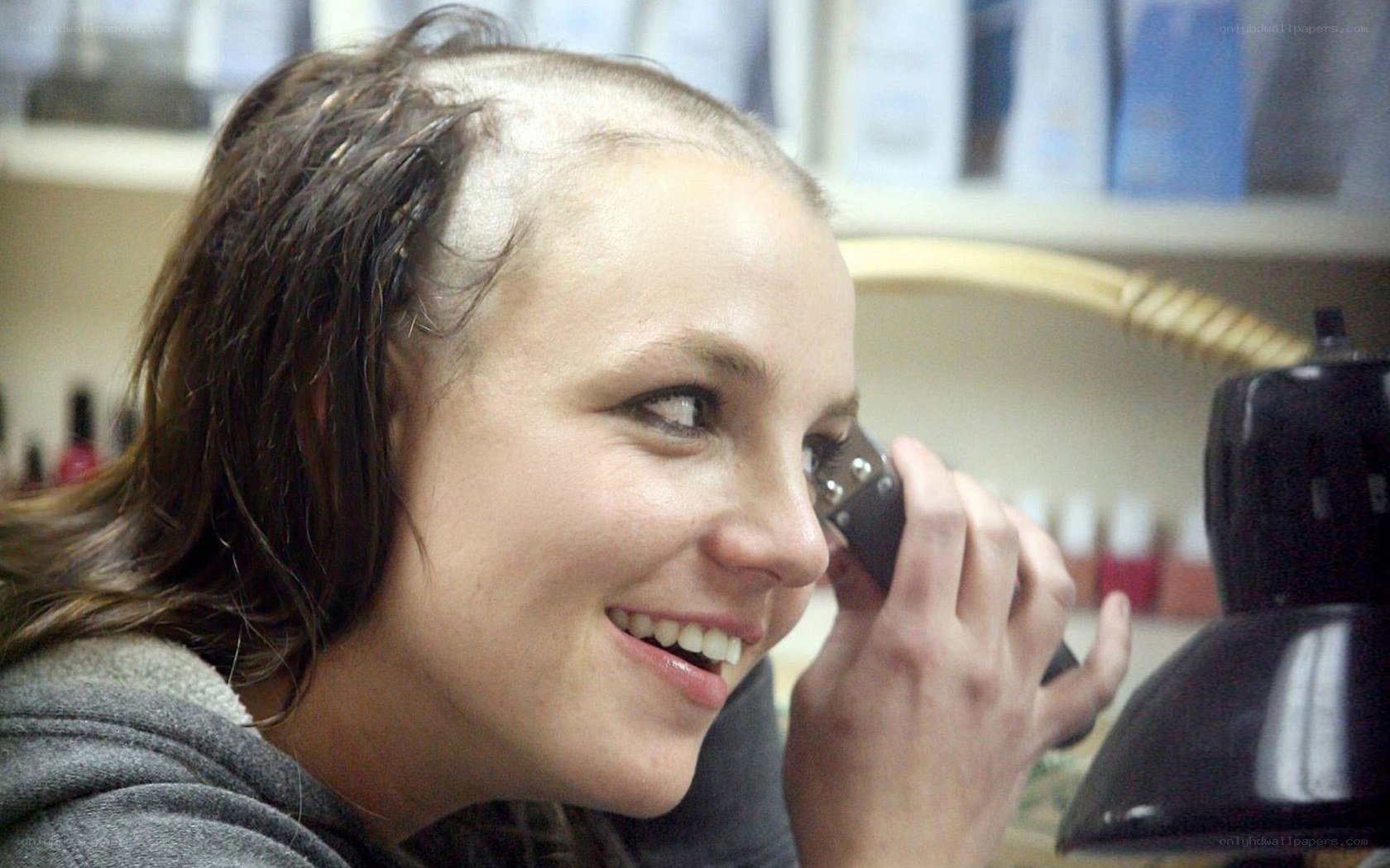 woman shaving her head