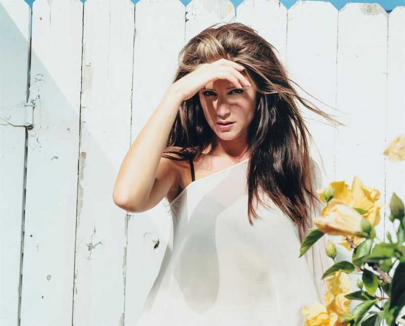 woman shielding eyes from sun
