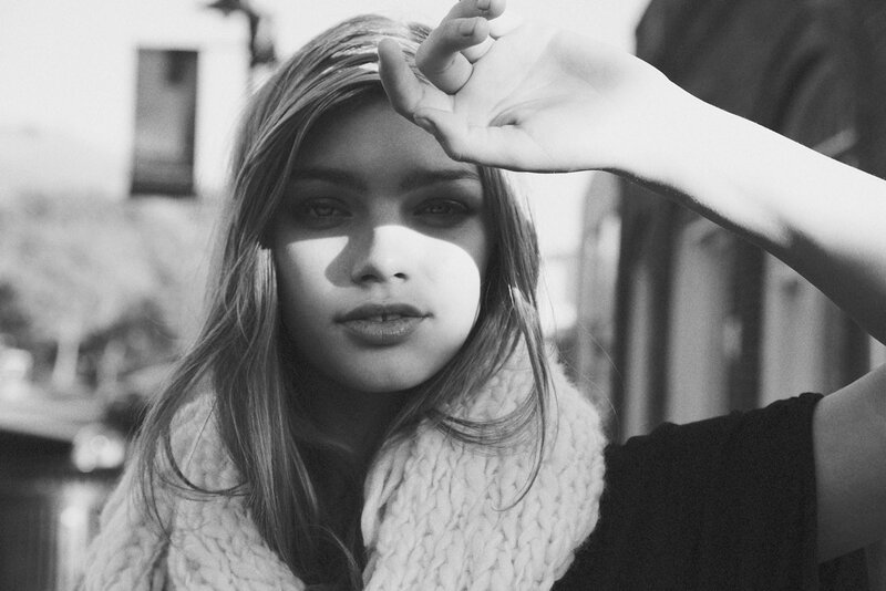 woman shielding eyes from sun