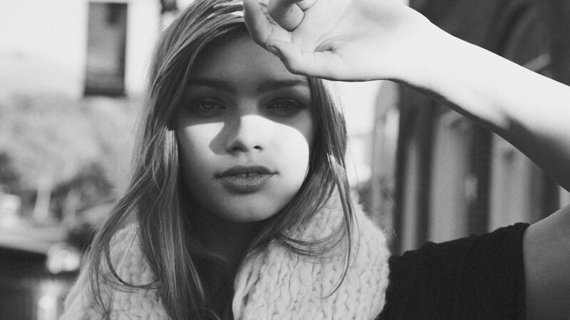 woman shielding eyes from sun