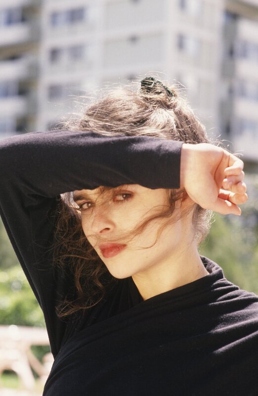 woman shielding eyes from sun
