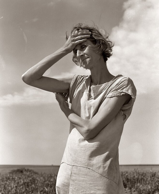 Woman shielding eyes from sun
