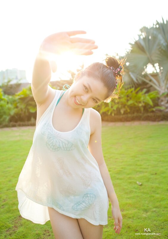 Woman shielding sun with hand