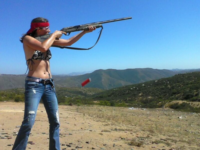 Woman Shooting Shotgun