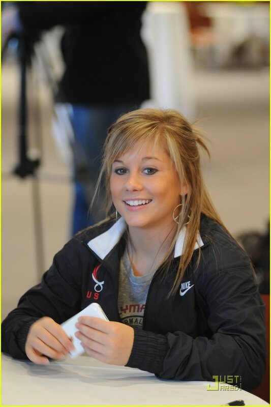 woman signing autograph