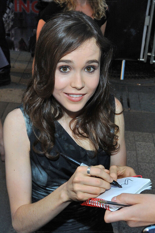 woman signing autograph