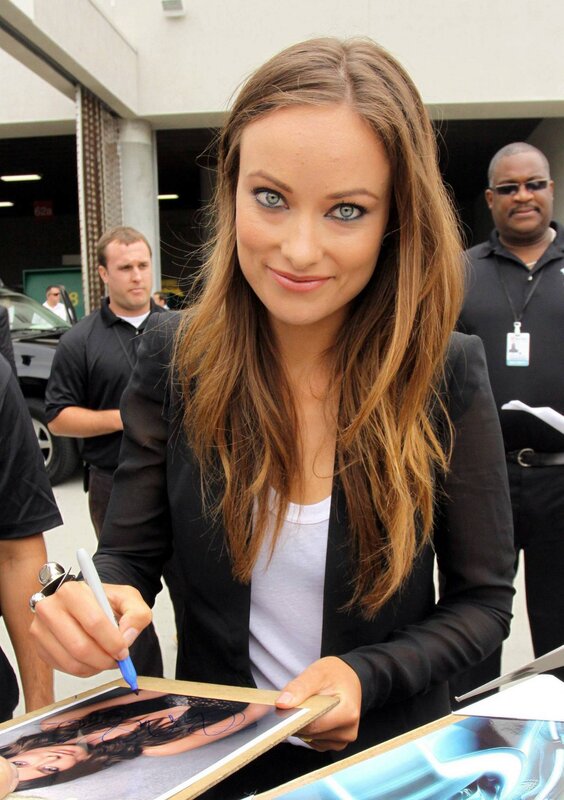 woman signing autograph