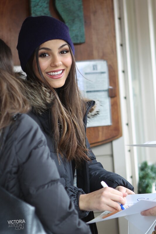 woman signing autograph