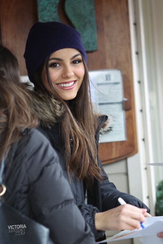 woman signing autograph