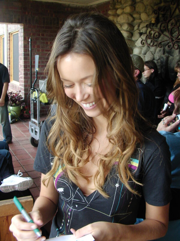woman signing autograph